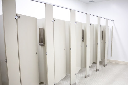 Several toilet stalls in a public restroom