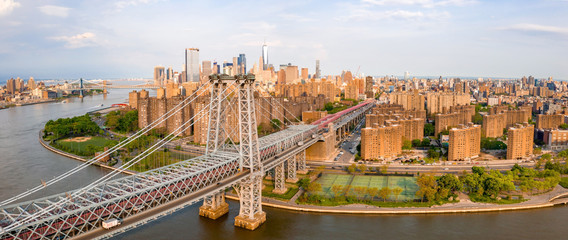 Aerial close up view of the George Washington Bridge at sunrise in Fort Lee, NJ. George Washington Bridge is a suspension bridge spanning the Hudson River connecting NJ to Manhattan, New York. © Aerial Film Studio