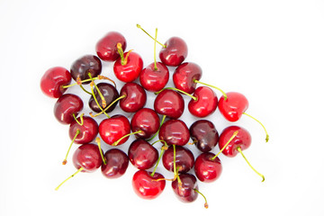 lots of cherries on a white background