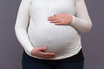 Expectant Mom Holding Growing Baby Bump