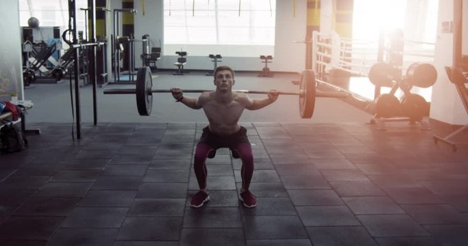 Athlete working in the gym with barbell