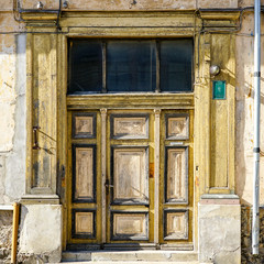 an old interesting three-piece wooden door in Liepaja