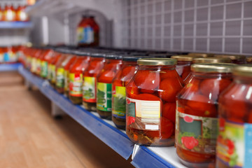 Fototapeta na wymiar Different pickle goods at shelves in food store