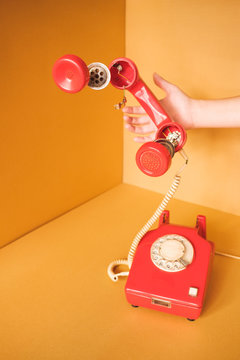 Old  Red Telephone With Parts Floating In The Air