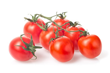 Fresh juicy red cherry tomato bunch closeup isolated on white background.