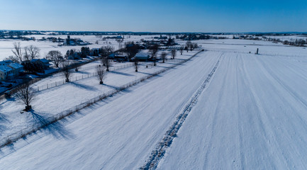 Obraz premium Aerial View of Morning Snow over Amish Countryside