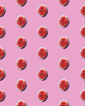 Brain candy arranged in a pattern on a pink background