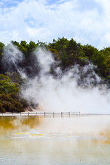 View of colorful steaming volcanic Champagne pool in geothermal Wai-O-Tapu wonderland in Rotorua, North Island, New Zealand. Tourist popular unique natural attraction. 