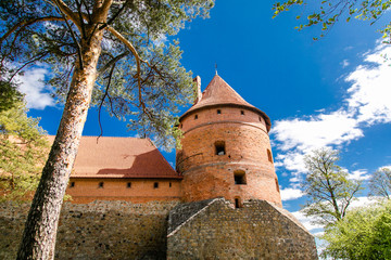 Trakai Island Castle in Lithuania, Eastern Europe. Tourists visit city castle. Famous ancient landmark