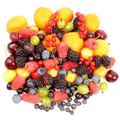 lots of fresh different berries on a white background