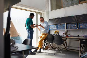 Teacher Discussing Over Project With Student