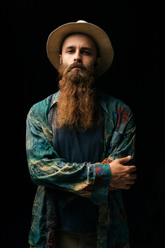 Young man with beard looking at camera