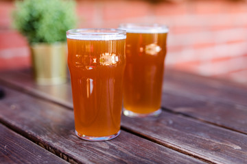 glass of beer on wooden table