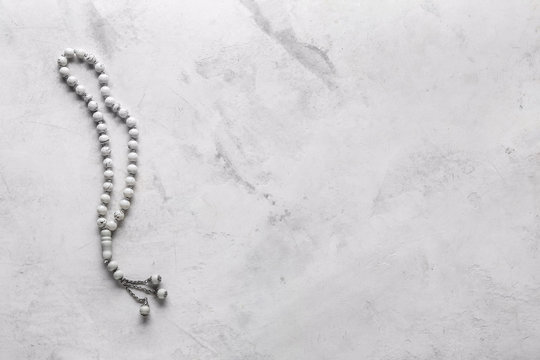 Muslim beads on light background