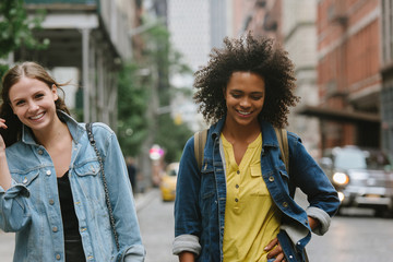 Friends walking in city