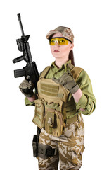 Beautiful fully equipped military soldier woman in protective armor tactical vest, camouflage pants, gloves, cap and glasses holding an automatic rifle M16, isolated photo.