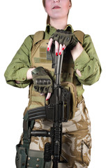Fully equipped US military soldier woman with red lacquer nails holding an automatic rifle M16, isolated photo.