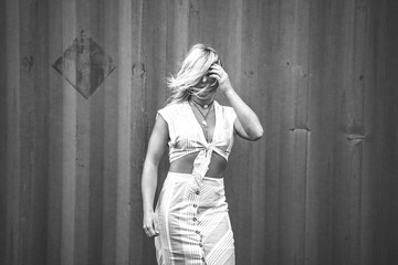 Fototapeta premium Blonde Model Showing Midriff in a Croptop 