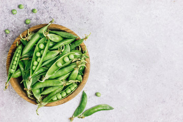 young green peas in bowl and Pods peas