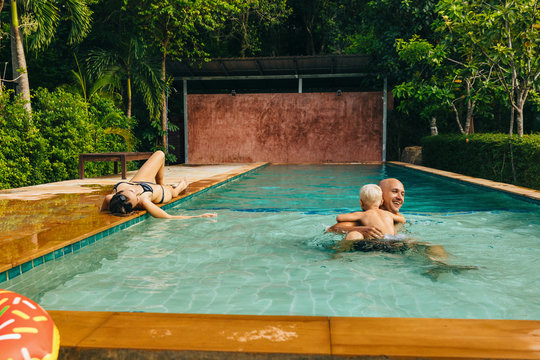 Family relaxing in the swimming  pool