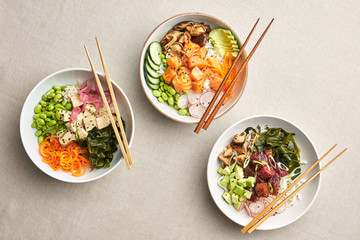 Different woks with fish and tuna.