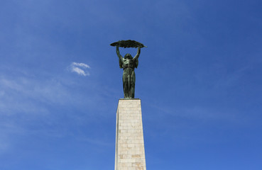 Statue of Liberty against the sky The monument is located on Gellert Hill in Budapest, Hungary