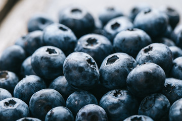 Fresh blueberry background. Texture blueberry berries close up. Vegan and vegetarian concept.