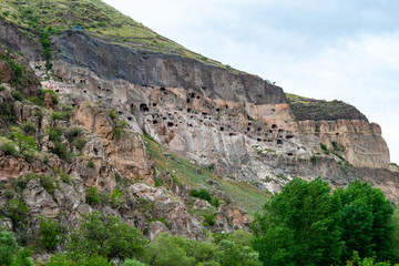 Fototapeta na wymiar View of Vardzia caves. Vardzia is a cave monastery site in southern Georgia, excavated from the slopes of the Erusheti Mountain on the left bank of the Kura River