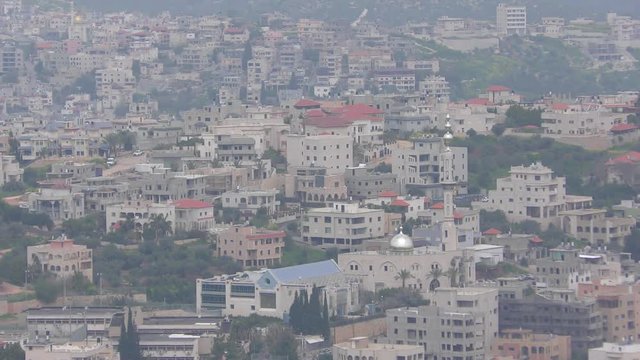 Skyline of Umm El Fahm, an Arab town with citizens of Israel. Umm al-Fahm is the social, cultural and economic center for residents of the Wadi Ara and Triangle regions.