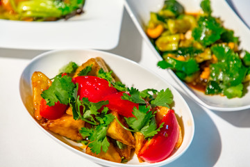 Chinese cuisine. fresh tomatoes and fried eggplant.