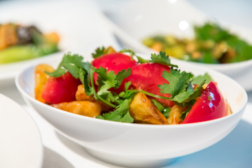 Chinese cuisine. fresh tomatoes and fried eggplant.