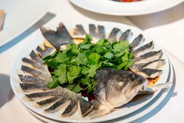 Chinese cuisine. sea bass cut into Chinese style thin slices without bones.