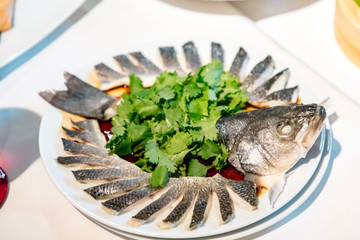 Chinese cuisine. sea bass cut into Chinese style thin slices without bones.