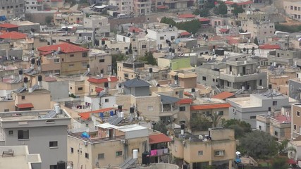 Skyline of Umm El Fahm, an Arab town with citizens of Israel. Umm al-Fahm is the social, cultural and economic center for residents of the Wadi Ara and Triangle regions.