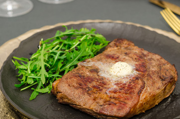 Roasted ribeye steak with arugula salad 