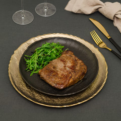 Roasted ribeye steak with arugula salad 