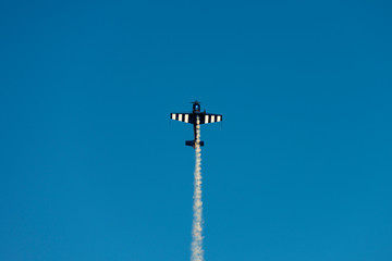 Airplane acrobatics in air show.