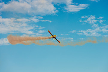 Airplane acrobatics in air show.