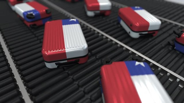 Many travel suitcases featuring flag of Chile on roller conveyer. Chilean tourism conceptual animation