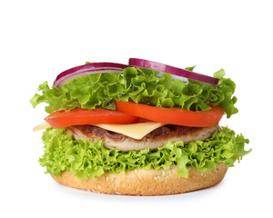 Burger bun with cutlet and vegetables isolated on white