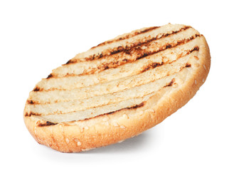 Half of grilled burger bun isolated on white