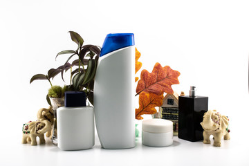 Cosmetic kit. Male care. Personal care. White and flowers background.