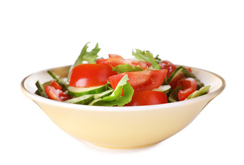 Delicious fresh cucumber tomato salad in bowl on white background