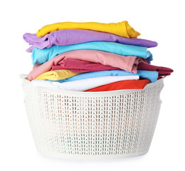 Plastic laundry basket with clean clothes on white background