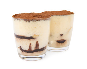 Two glasses of tiramisu cake isolated on white
