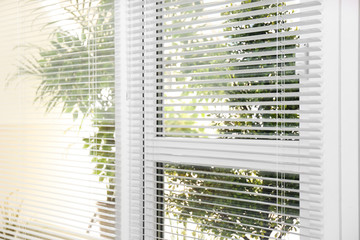 Open white horizontal window blinds, closeup view