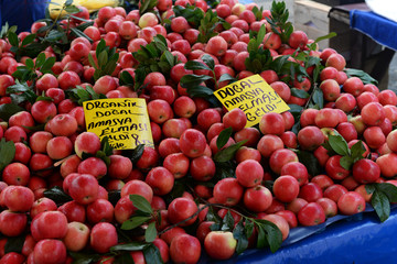 lots of red fruit apples at a market