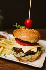 Hamburger with French fries and sauce in a restaurant