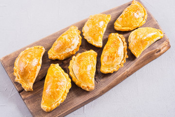 Latin American baked beef empanadas with sauce