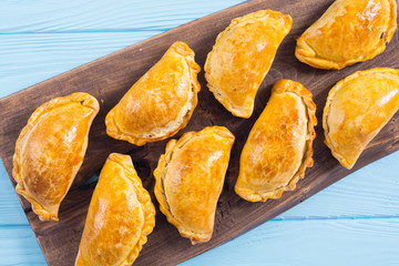 Latin American baked beef empanadas with sauce